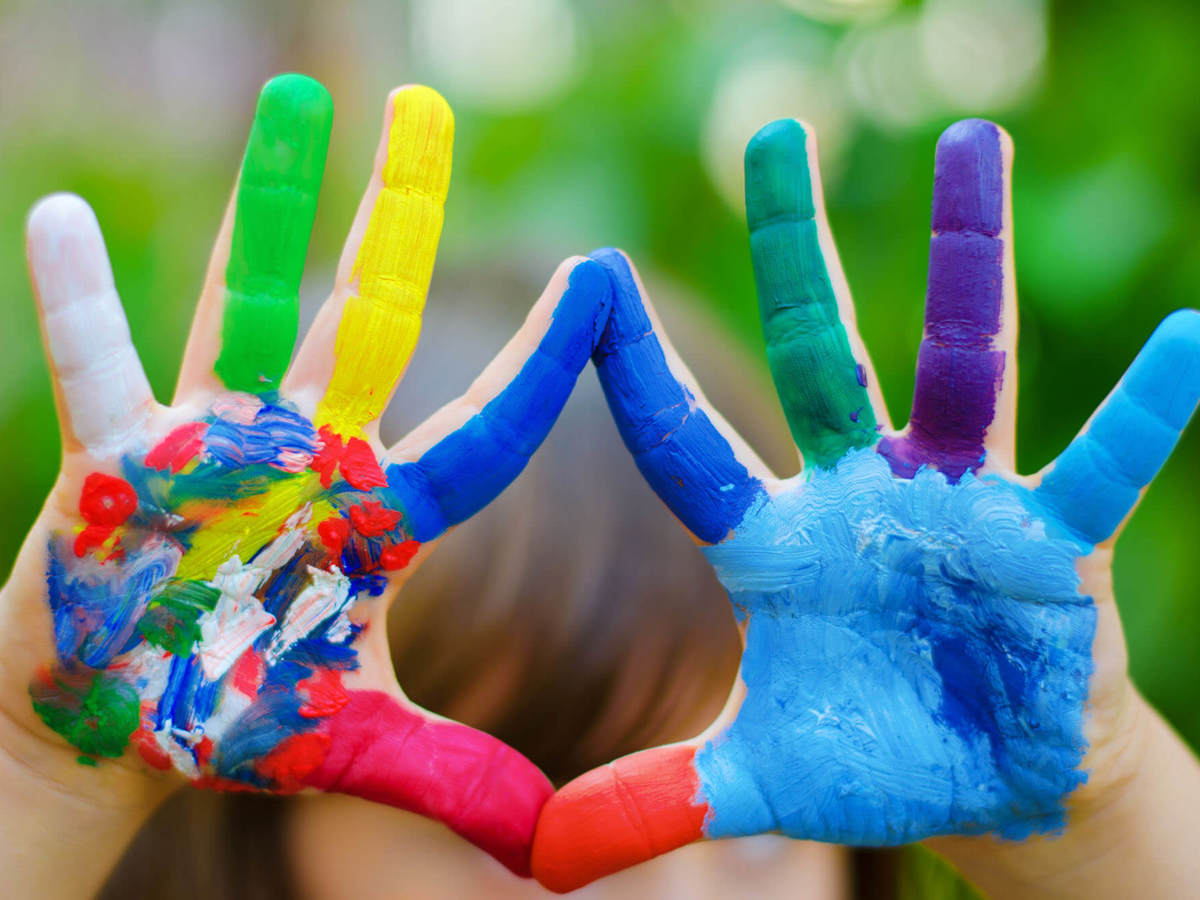 Pupils-learning hands covered in coloured paint