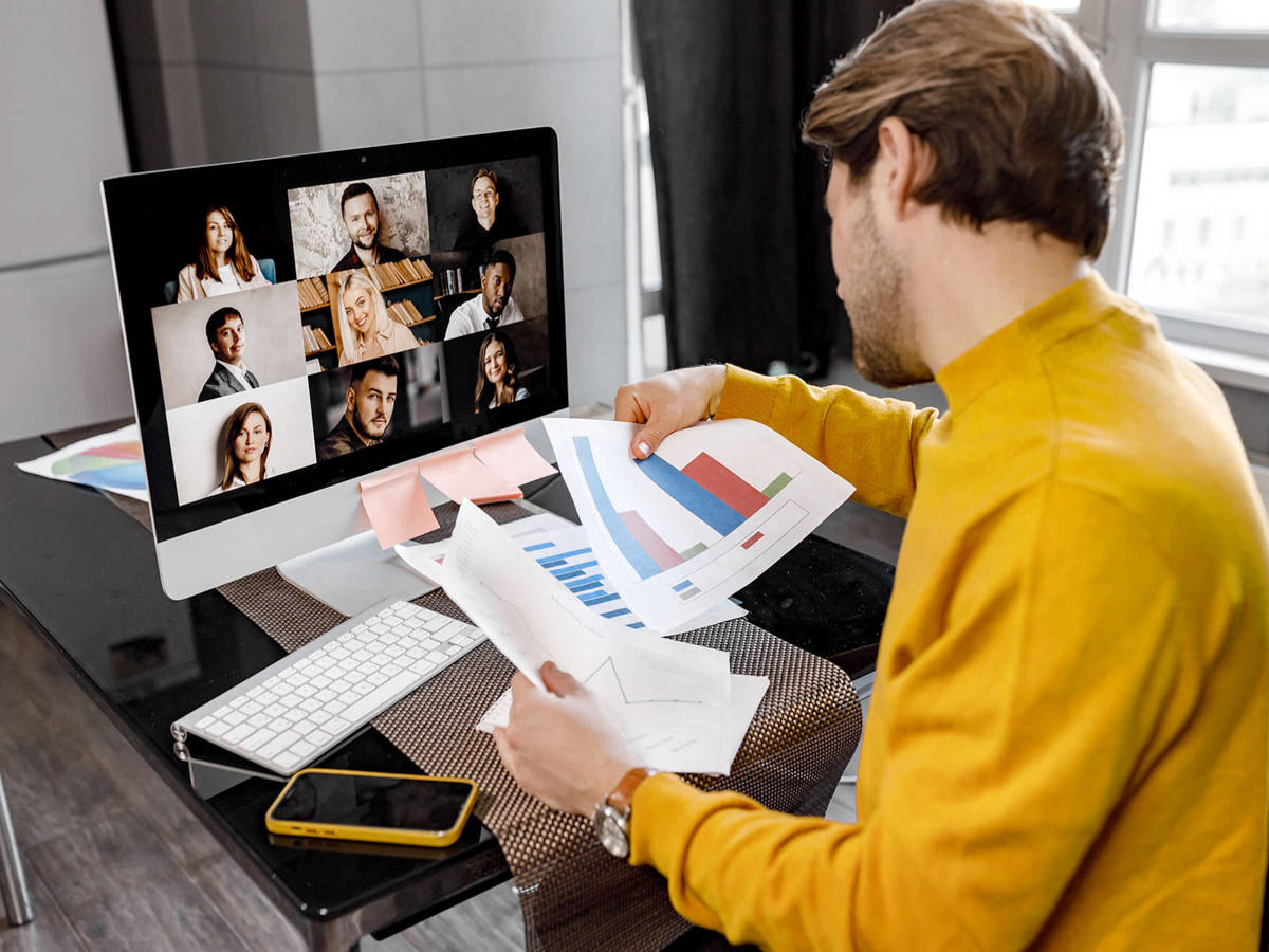 tools-resources someone in a video call with nine others checking over graphs