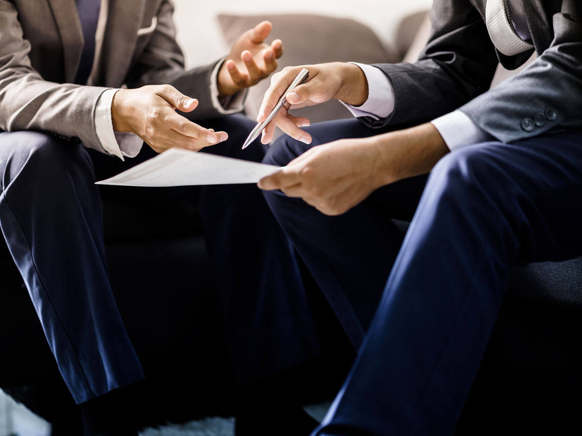 tools-resources two individuals checking over a document