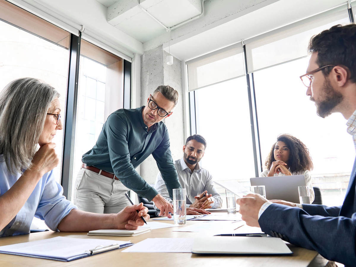 Man pointing out something in meeting