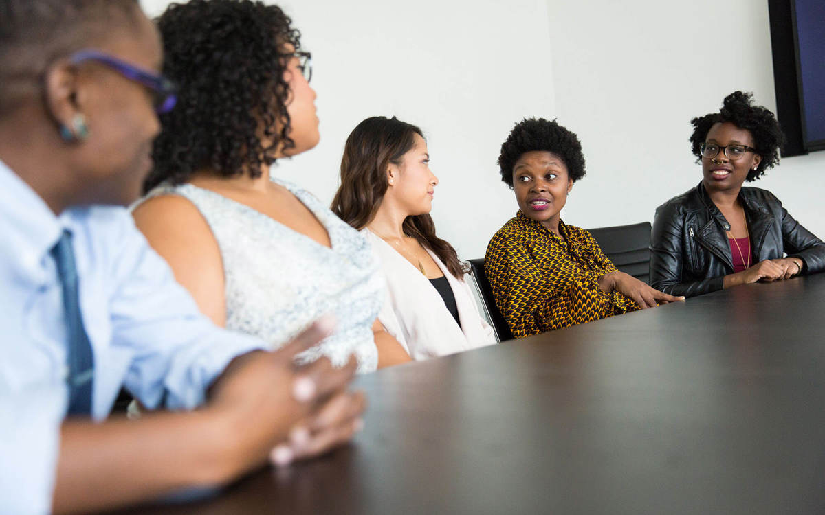 Line of people talking holding a meeting