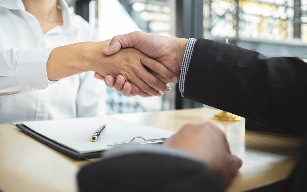 two people shaking hands